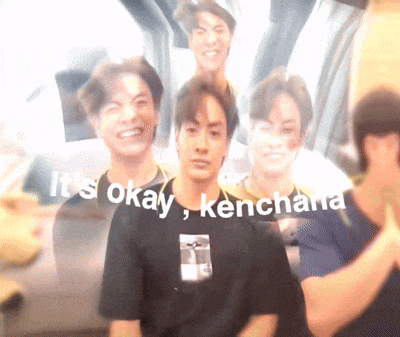 a blurry picture of a man with the words it 's okay kenchana written on the bottom