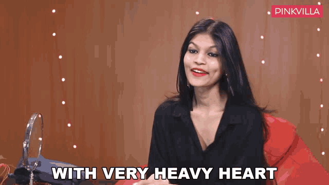 a woman says " with very heavy heart " in a video