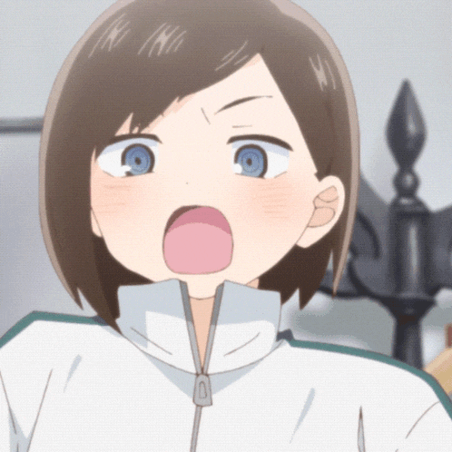 a girl with short brown hair and blue eyes is making a funny face