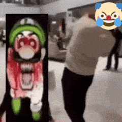 a man is standing in front of a clown with a bloody face