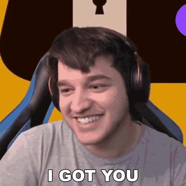 a man wearing headphones smiles and says i got you