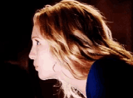 a close up of a woman 's face with blonde hair
