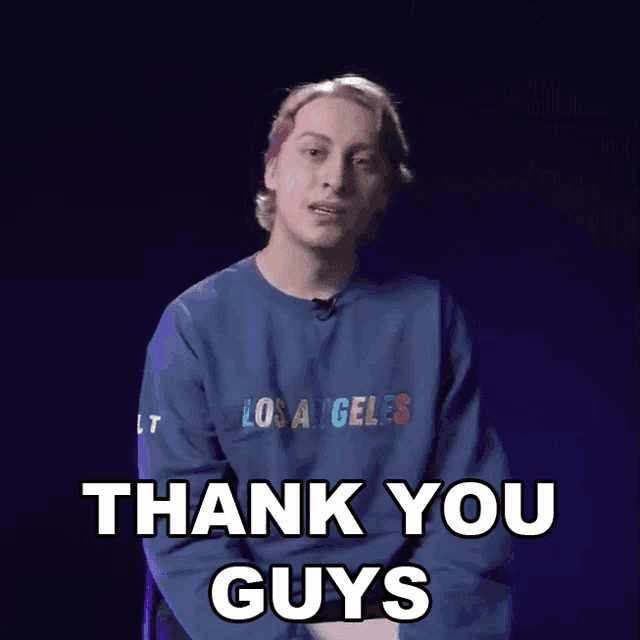 a man wearing a blue los angeles sweatshirt is saying thank you guys