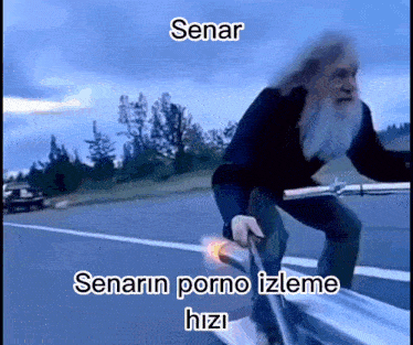 a man with a beard is riding a bike on a highway with the words senarin porno izleme hizi on the bottom