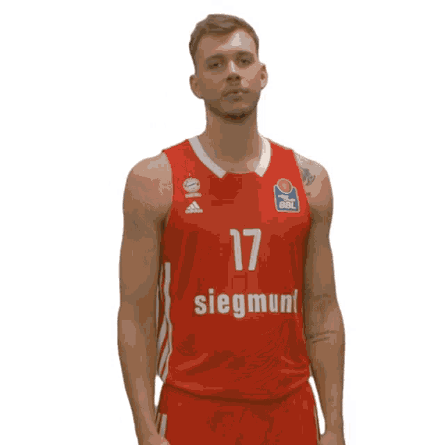 a man wearing a red siegmund jersey stands in front of a white background