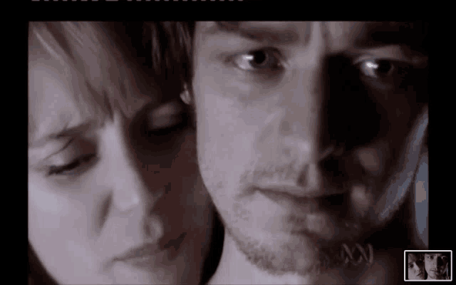 a close up of a man 's face and a woman 's face with the letters a and n visible