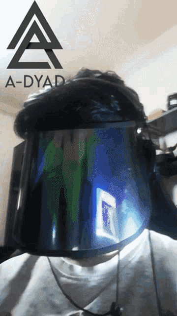 a person wearing a helmet with a a-dyad logo above them
