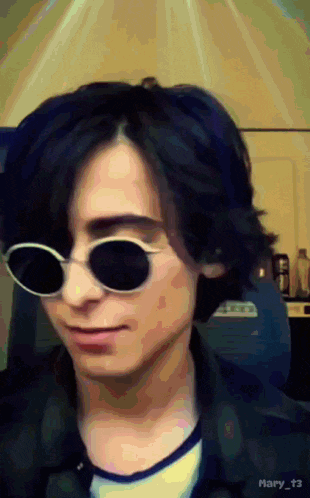 a close up of a person wearing sunglasses with the hashtag mary_t3 on the bottom