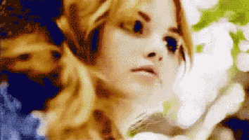 a pixelated image of a woman with blonde hair