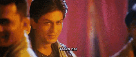 a close up of a man 's face with the words teekh hai written on it .