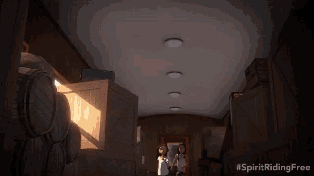 two girls are standing in a room with the words spirit riding free