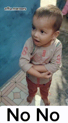 a baby is standing with his arms crossed and says no