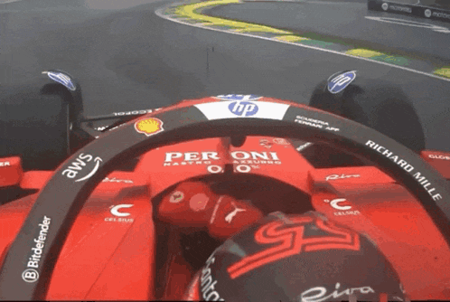 a red race car with hp and richard mille written on it