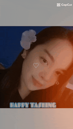 a picture of a girl with a flower in her hair with the caption happy tasting