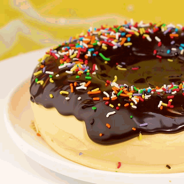 a donut with chocolate frosting and sprinkles on top
