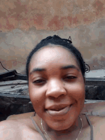 a close up of a woman 's face smiling
