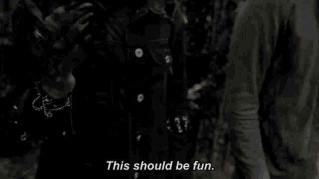a woman in a denim jacket is standing in the woods and says `` this should be fun '' .