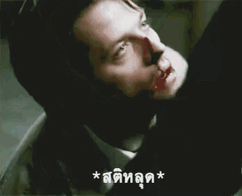 a man with a bloody nose and a foreign language on his face .