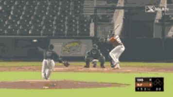 a baseball game is being played with a scoreboard showing a score of 5-2