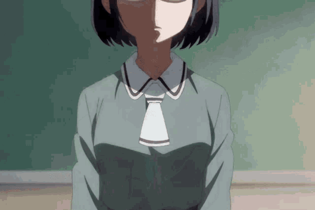 a girl wearing glasses and a tie is looking at the camera