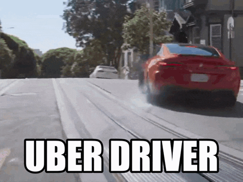 a red car is driving down a street with the words uber driver written on the bottom