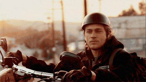 a man wearing a helmet and a jacket that says redwood