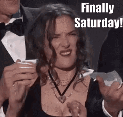 a woman is making a funny face while holding a piece of paper with the words `` finally saturday '' .