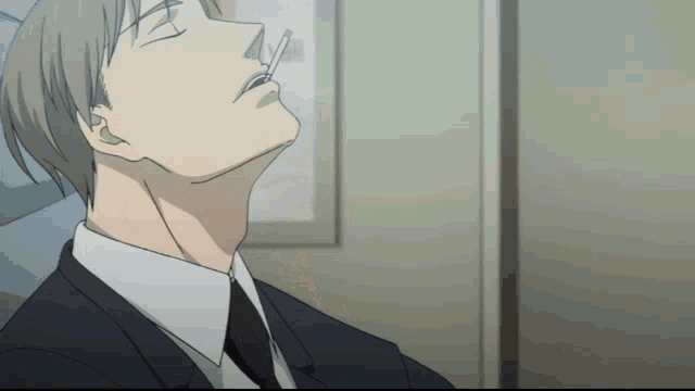 a man in a suit and tie is looking up