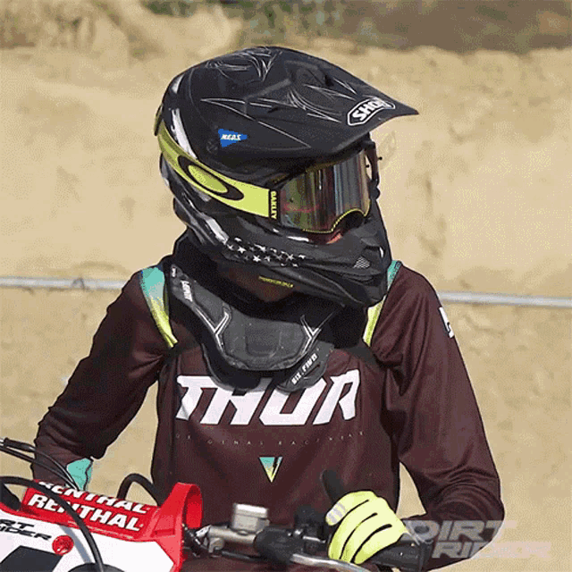 a person wearing a helmet and a shirt with thor on it