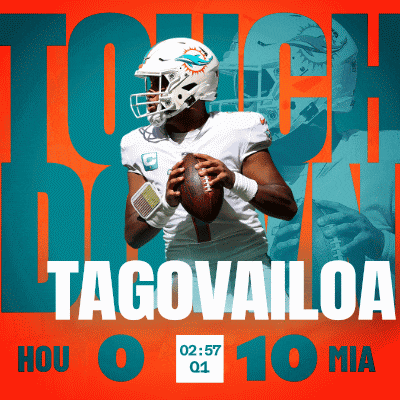 a miami dolphins football player holding a football