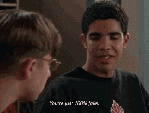 two young men are talking to each other and one of them is saying you 're just 100 % fake