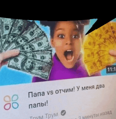 a girl is holding a fan of money and a piece of cheese