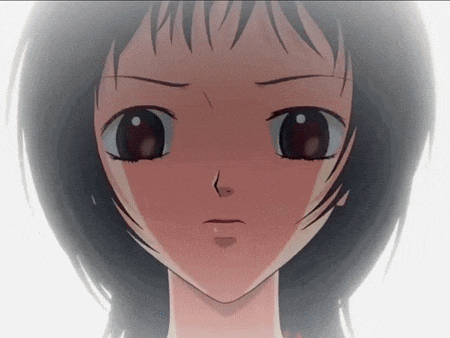 a close up of a girl 's face with a serious expression
