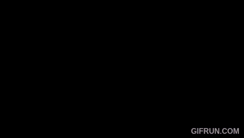 a girl with pink hair and blue eyes has a gif run.com watermark on the bottom right