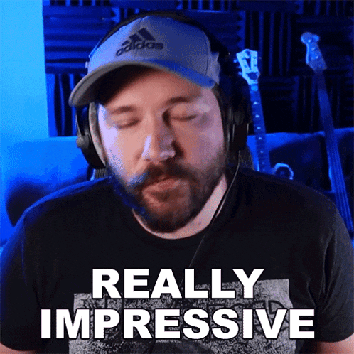 a man wearing headphones and a hat says " really impressive "