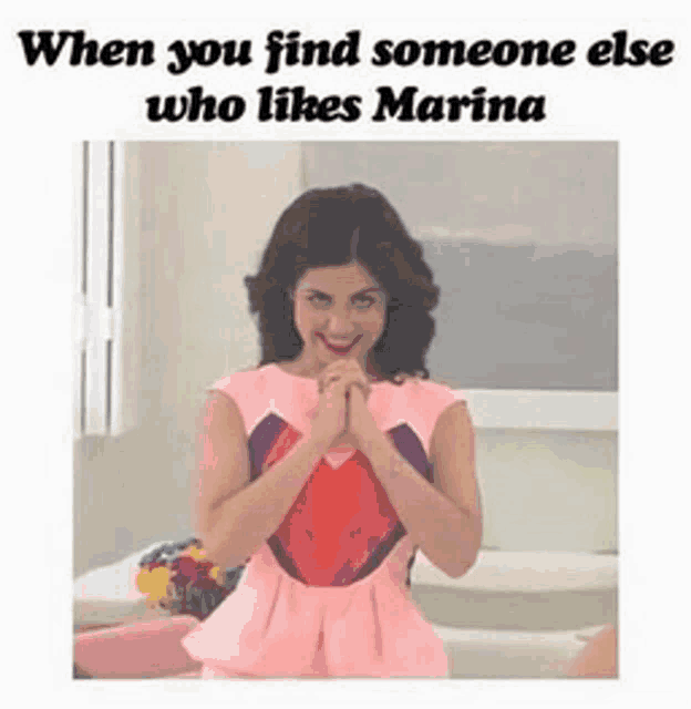 a picture of a woman in a pink dress with the caption when you find someone else who likes marina .