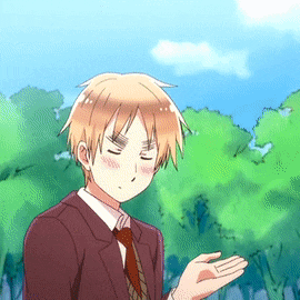 a man in a suit and tie holds out his hand in front of trees