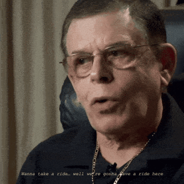 a man wearing glasses says " wanna take a ride well we 're gonna take a ride here "