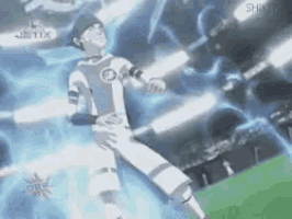 a man in a soccer uniform is kicking a ball in a stadium .