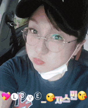 a woman wearing glasses and a hat with the word love written on it