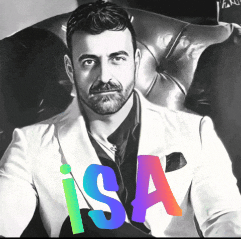 a man with a beard is sitting in a chair with the name isa on the bottom right