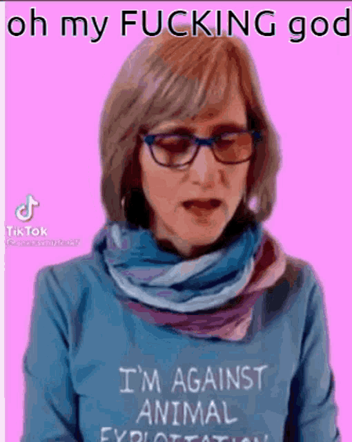 a woman wearing glasses and a sweater that says `` i 'm against animal exploitation ''