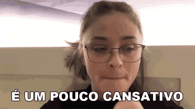 a woman wearing glasses says " e um pouco cansativo " in a foreign language