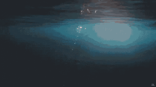 the sun is shining through the water and shining through the water .
