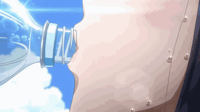 a girl is drinking water from a bottle with the letter l on it