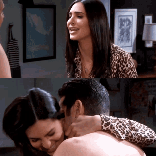 a woman in a leopard print shirt smiles while hugging a man