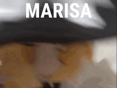 a close up of a person wearing a hat with marisa written in white letters