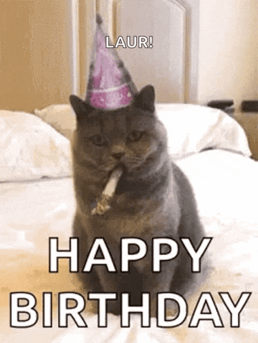 a cat wearing a party hat is sitting on a bed with a cigarette in its mouth .
