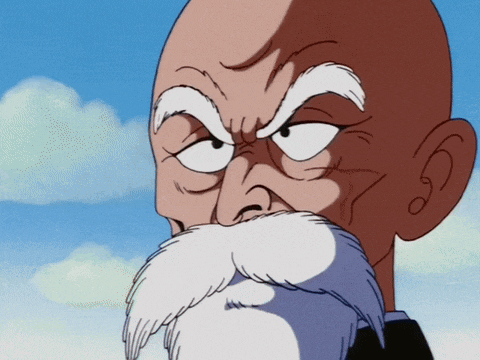 a bald man with a white beard looks angry