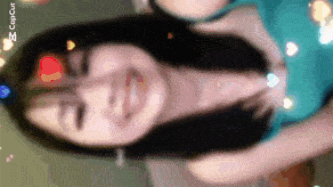 a woman 's face is shown in a blurry photo with a caption that says " copcut "